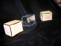 Wooden boxes with interlocking fingerjoints, etched on the outside